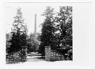 Davis Arboretum gate and Power Plant smokestack 
